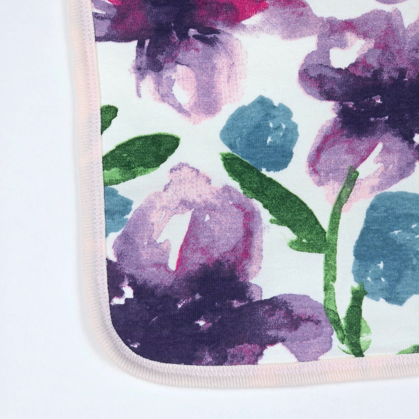 Burt's Bees Baby bib with a watercolor floral design